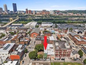an aerial view of a city with a red arrow at Luxury and Stylish 2Bedroom Apartment on Carson, South Flats, Pittsburgh in Pittsburgh