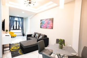 a living room with a couch and a table at 592 Apartments 12 Duncan Street Campbellville, Georgetown in Georgetown