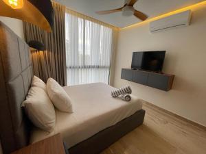 מיטה או מיטות בחדר ב-2 bed Elegant apt Aldea Zama great location