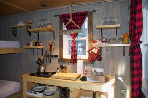 a kitchen with a sink and a counter with a window at Gollé Goulu in Saint Come