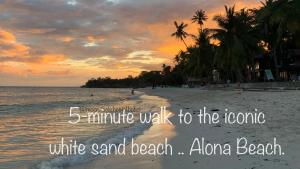 a beach with the words minute walk to theonomic white sand beachaiden at Moon Fools Hostel in Panglao Island