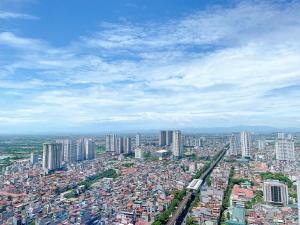 an overhead view of a city with a train at TSQ STAY Hotel Apartment in Hanoi