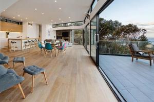 an open living room and dining room with sliding glass doors at Sea Ranch in Wye River