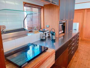 a kitchen with a counter top in a kitchen at &SUN Penthouse in Yokosuka