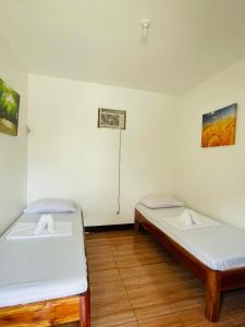 Postel nebo postele na pokoji v ubytování 3 Sisters Guest House 1