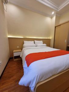 Ein Bett oder Betten in einem Zimmer der Unterkunft core inn juwita hotel