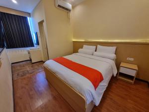 Ein Bett oder Betten in einem Zimmer der Unterkunft core inn juwita hotel
