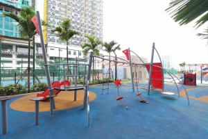 a playground in a city with a play equipment at Bali Residences @ Icon Stay Melaka in Melaka