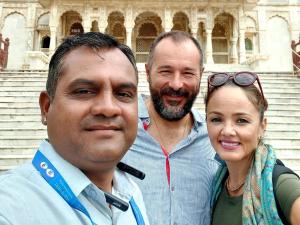 two men and a woman posing for a picture at Nandini Paying Guest House in Udaipur