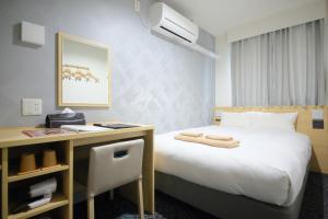 Postel nebo postele na pokoji v ubytování Hotel Shin-Imamiya + 37 fotografií