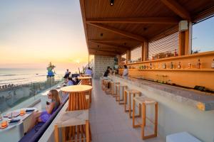 a restaurant with a view of the ocean at Sau Bali Beach House Canggu in Canggu