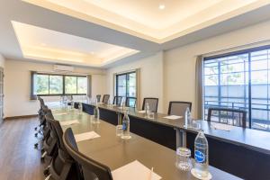 a conference room with tables and chairs and windows at Anana Ecological Resort Krabi - SHA Extra Plus in Ao Nang Beach +168 photos