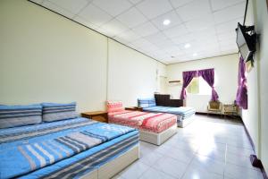 Postel nebo postele na pokoji v ubytování Xi Cun Homestay