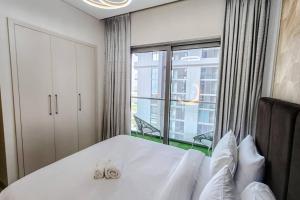 Postel nebo postele na pokoji v ubytování STAY BY LATINEM Luxury 1BR Holiday Home CVR A702 near Burj Khalifa + 12 fotografií