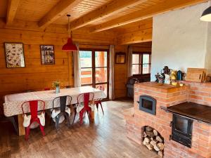 a dining room with a table and a fireplace at Wilk u Drzwi in Ustrzyki Dolne +42 photos