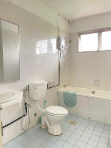 A bathroom at 4BR 9pax in Kuching city