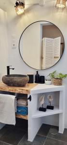 a bathroom with a sink and a mirror at B&B La Mimosa in Teguise +37 photos