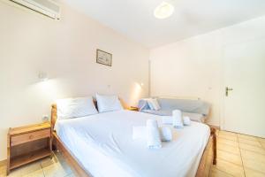 Postel nebo postele na pokoji v ubytování Arianna apartment 17