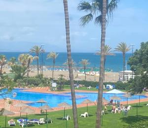 The swimming pool at or close to Playamar Primera linea front beach