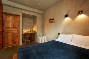 Postel nebo postele na pokoji v ubytování Untapped Hostel