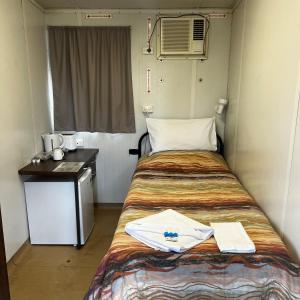 Postel nebo postele na pokoji v ubytování Jambin hotel motel