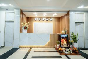 a lobby with a large whiteboard on the wall at King Hotel in Nha Trang
