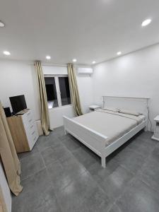 Postel nebo postele na pokoji v ubytování Villa La Preneuse