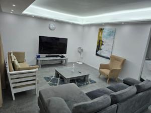 TV a/nebo společenská místnost v ubytování Villa La Preneuse