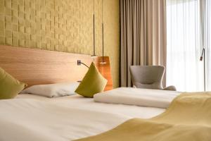 Letto o letti in una camera di Novotel Karlsruhe City