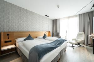 Letto o letti in una camera di Novotel Karlsruhe City