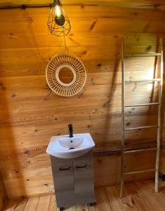 a bathroom with a sink and a fan at Spokojny zakątek in Silice