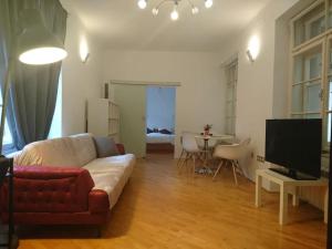 a living room with a couch and a television at Apartment Rahela in Zagreb