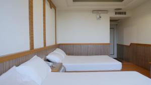 Postel nebo postele na pokoji v ubytování Wun Sun Hotel + 22 fotografií