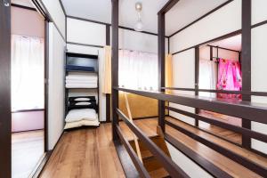 a room with a balcony with a closet at Ikebukuro Max14ppl 6bedrooms 11beds 1200sqft in Tokyo