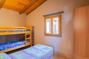 Postel nebo postele na pokoji v ubytování Camping Urbion