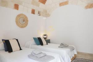 Posteľ alebo postele v izbe v ubytovaní TD Casa Marevino Seaside Terrace with Panoramic Views + 12 fotografií