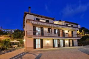 a large house with a balcony on top of it at Casa Vacanze Villa Liotta in Agropoli
