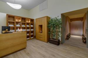 a lobby with a potted plant in a room at CoolRooms Palacio Villapanés 5 GL in Seville +37 photos