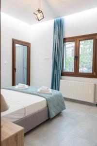 Postel nebo postele na pokoji v ubytování Orion Residence Ι