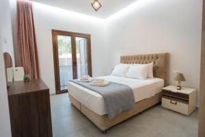Ένα ή περισσότερα κρεβάτια σε δωμάτιο στο Orion Residence Ι +38 φωτογραφίες