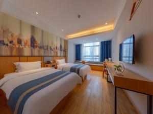 Postel nebo postele na pokoji v ubytování GreenTree Eastern Hotel Jiaxing Jiangnan Moore Store + 37 fotografií