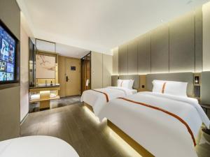 Letto o letti in una camera di GreenTree Eastern Hotel Nanjing Jiangning University