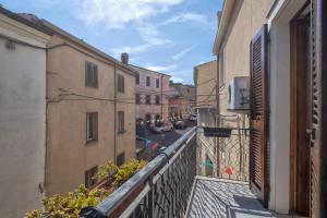 an apartment balcony with a view of a street at Relax House and Fitness 8 in Villanova Monteleone