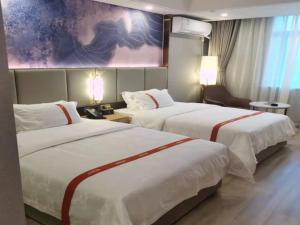 Cama o camas de una habitación en GreenTree Eastern Hotel Yueqing Shifu Chenmu Square