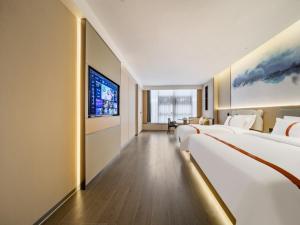Letto o letti in una camera di GreenTree Eastern Hotel Nanjing Jiangning University