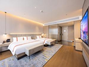 Letto o letti in una camera di GreenTree Eastern Hotel Nanjing Jiangning University