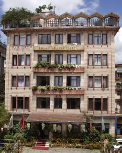 a large building with plants on the front at Hotel Marshyangdi in Kathmandu