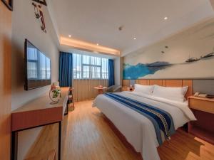 Postel nebo postele na pokoji v ubytování GreenTree Eastern Hotel Jiaxing Jiangnan Moore Store