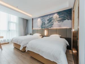Katil atau katil-katil dalam bilik di GreenTree Inn Jiangsu Yancheng Dongtai Overseas