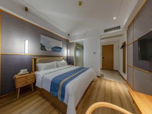 Postel nebo postele na pokoji v ubytování GreenTree Eastern Hotel Jiaxing Jiangnan Moore Store